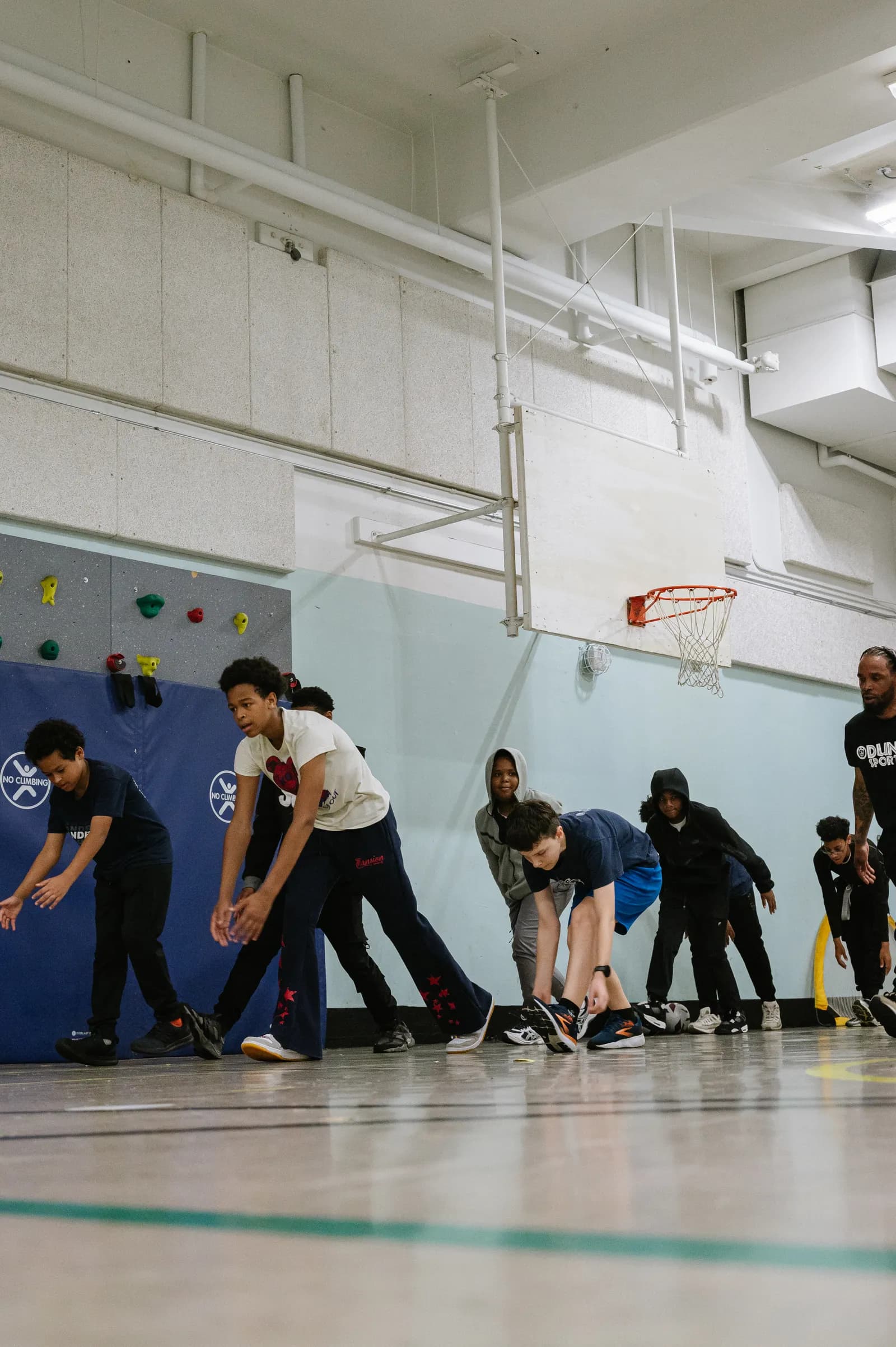 Youth athletes lined up at the start line ready to sprint